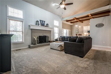 Cozy brick fireplace and open to kitchen/dinette a
