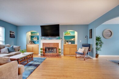 The spacious great room offers, hardwood flooring,