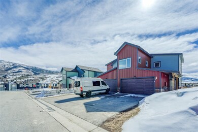 View of snowy exterior with board and batten sidin