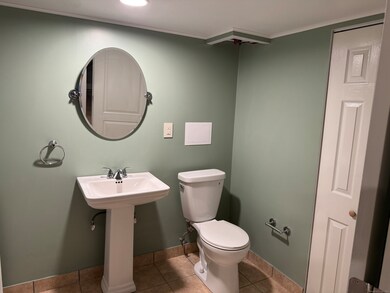 Laundry room half bathroom located in the basement