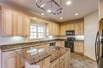 Eat In Kitchen With Granite Countertops And Ample Storage Space