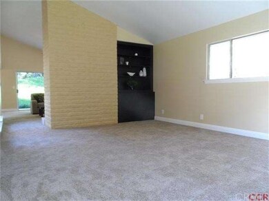 Natural lights flows into the formal living room. 