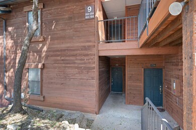 View of exterior entry featuring a balcony
