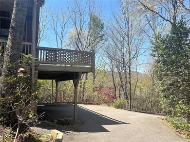 Driveway view of large side Deck and mountain view