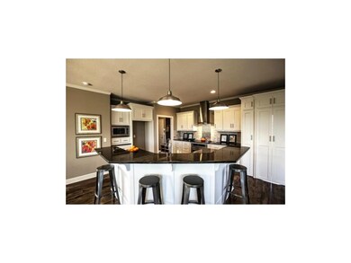 Kitchen with  large center island.  Home is under 