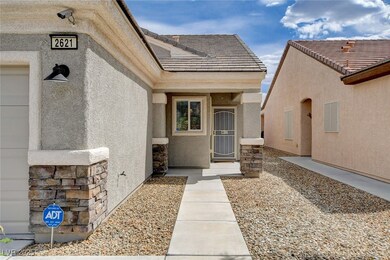 Entrance to property featuring stucco siding, a ti