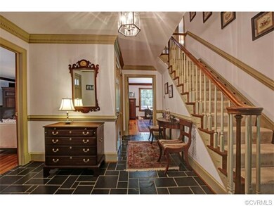 Gracious slate foyer open to formal living room, f