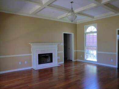 Freshly Painted greatroom with new wood floors and
