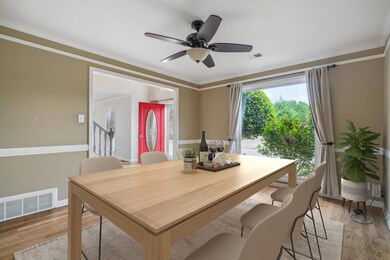 Dining room with light wood-type flooring, a ceili