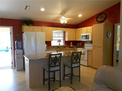 Kitchen with Granite counters and pass through win