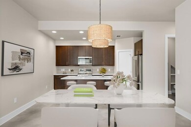 Kitchen featuring dark brown cabinets, stainless 