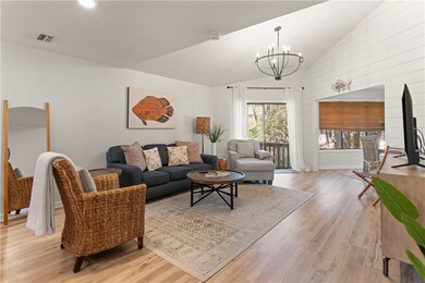 Open concept family room with ship lap accent wall