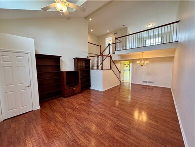 Living room with guest closet and built-ins.
