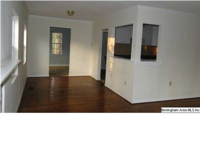 Living room view to dining area and kitchen