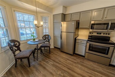 Eat-in kitchen with stainless appliances quartz co
