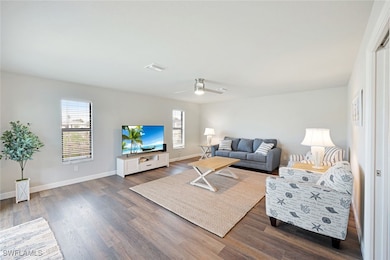 Living area featuring plenty of natural light, dar