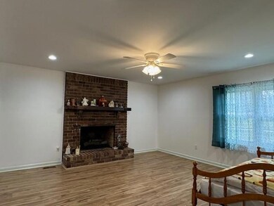 Living room featuring wood-type flooring, ceiling 