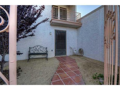 Exterior Front. Courtyard entry with iro