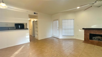 Unfurnished living room with light tile patterned 