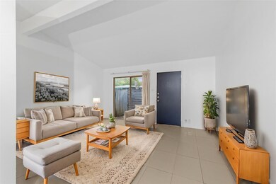 Living area with light tile patterned floors