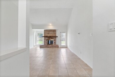 This is a spacious, well-lit living room featuring