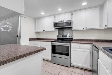 Kitchen featuring light tile patterned floors, whi