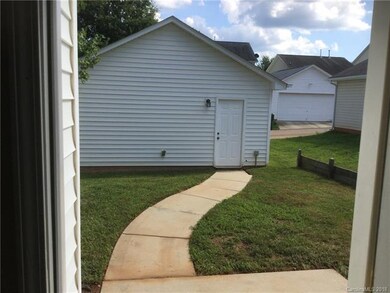 Detached 2 car garage with an additional parking a