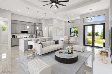 Living area with marble finish floor, a high ceili