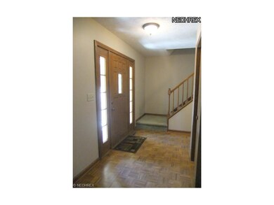 The foyer welcomes you in to the home and features