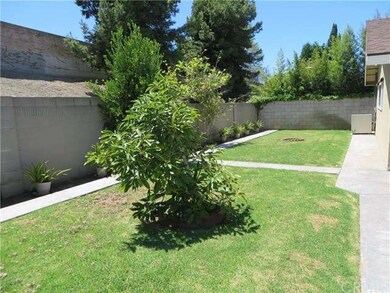 Spacious easy maintenance back yard with block wal
