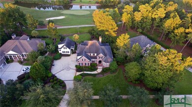 Aerial view of home with guest cottage .