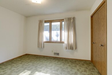 One of three main level bedrooms, pristine hardwoo