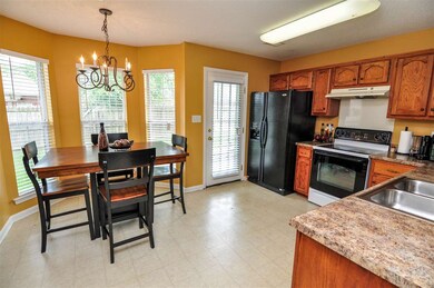 The kitchen is accented with tons of cabinet/count