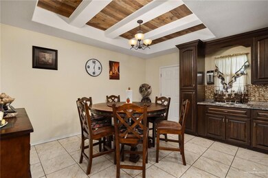 Dining space featuring light tile patterned floors, wooden ceiling, baseboards, beamed ceiling, and an inviting chandelier
