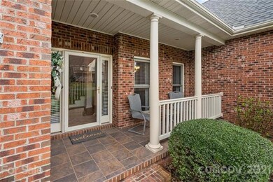 Rocking-chair front porch with custom tile floor.