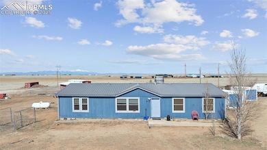 View of front of home featuring metal roof