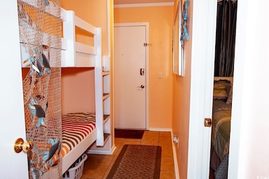 Mudroom featuring tile patterned flooring and base