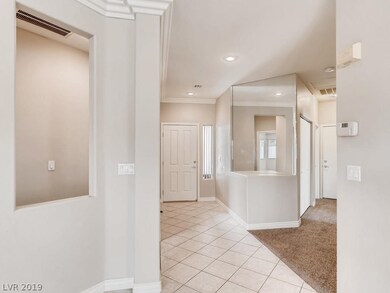 Welcoming front foyer. Secondary bedrooms to the r
