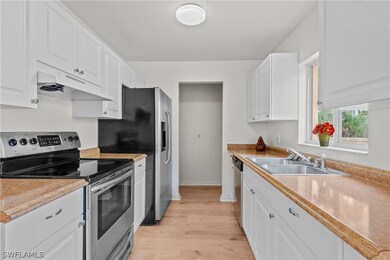 1206 Jaguar Blvd, Lehigh Acres, FL 33974 - photo 6