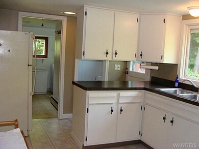 Kitchen Bright kitchen leads to laundry room