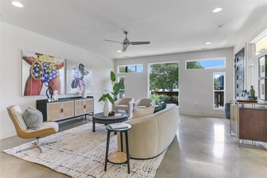 Living area featuring finished concrete flooring,