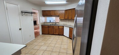Another view of the kitchen with tile flooring thr