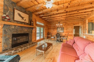 Living/dining room with two sliding doors to sceni