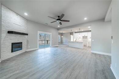 Large great room open to the kitchen and direct access and view of the huge deck and awesome backyard