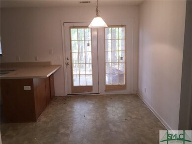 Dining Room with French doors leading to patio and