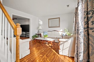 Living Room featuring stairs, visible vents, and w