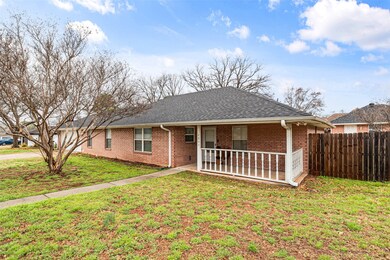 Ranch-style home featuring a front lawn and a porch