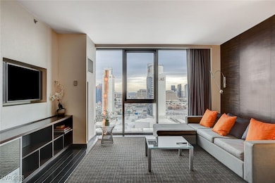Living room with floor to ceiling windows, wood fi