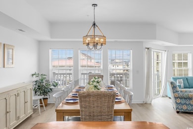 Dining room with an inviting chandelier, plenty of