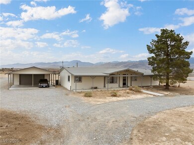 View of front of property with a mountain view, a
